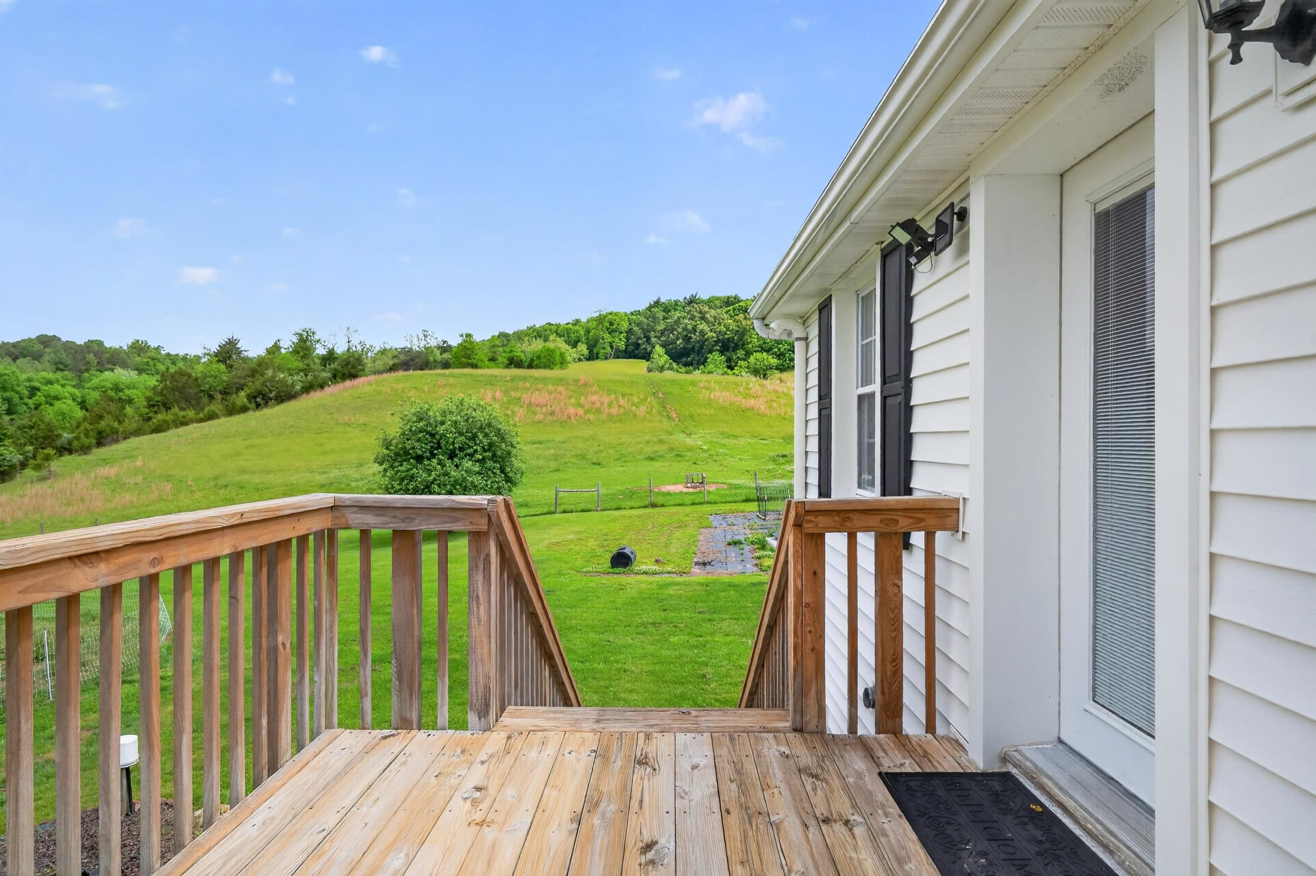 View of rolling hills from a deck.
